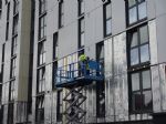 Cladding being taken down on Spruce Court